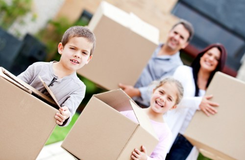 Packed office boxes and desks ready for transport in Beckton