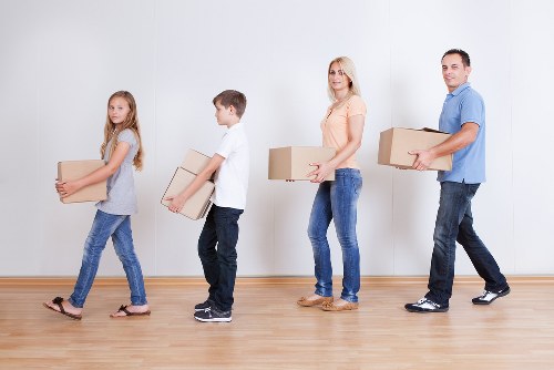Packed boxes and furniture ready for transport during a Beckton house removal