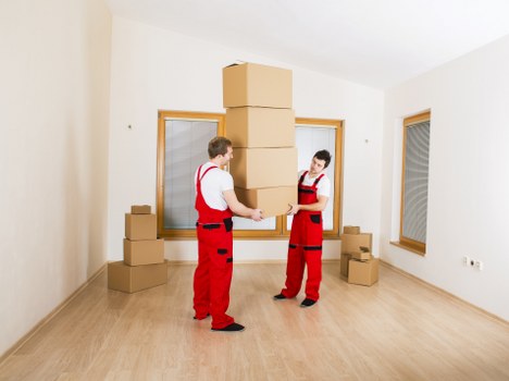 Local removals team handling furniture and boxes in Beckton