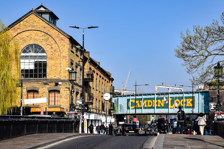 A large multi-storey commercial building with a sign reading 'Big Yellow Self Storage' positioned atop the roof, featuring multiple rows of rectangular windows with yellow frames. In front of the buil
